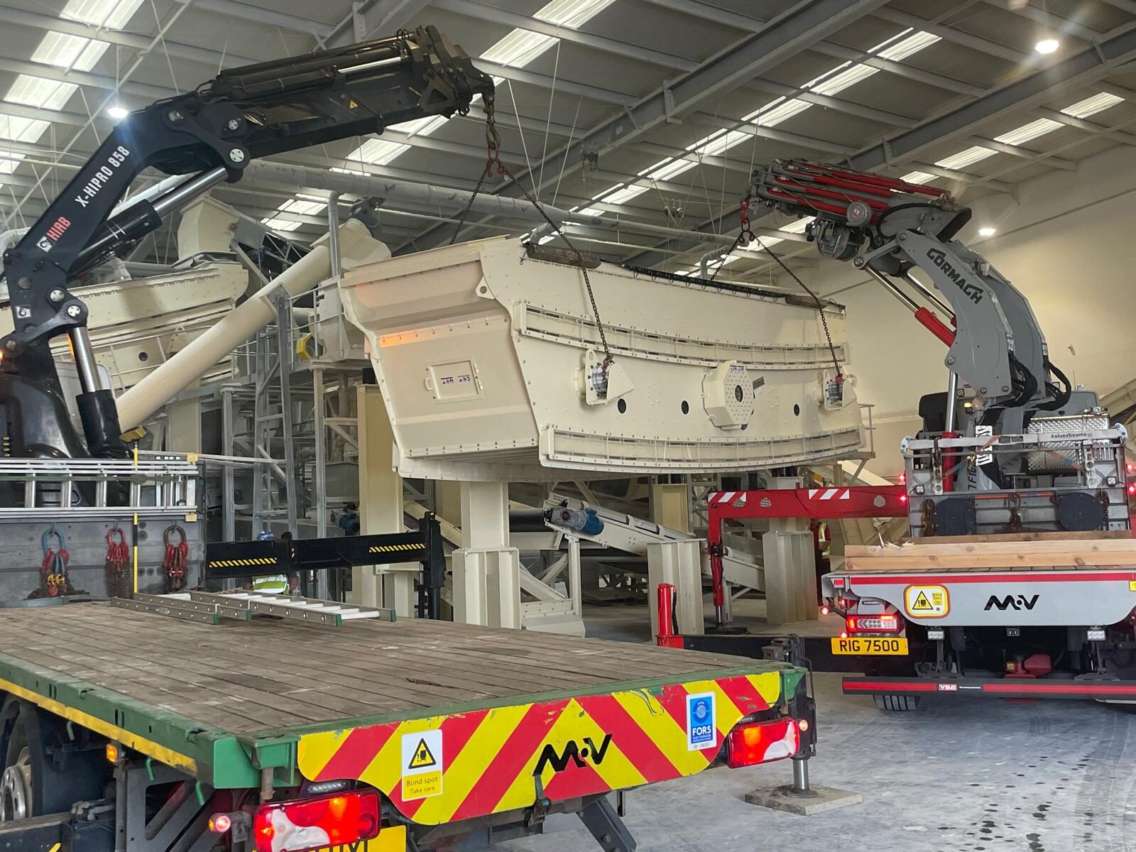 A screen body being craned into position during a plant build